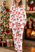 Model wearing bow-print pajamas in a realistic Christmas setting